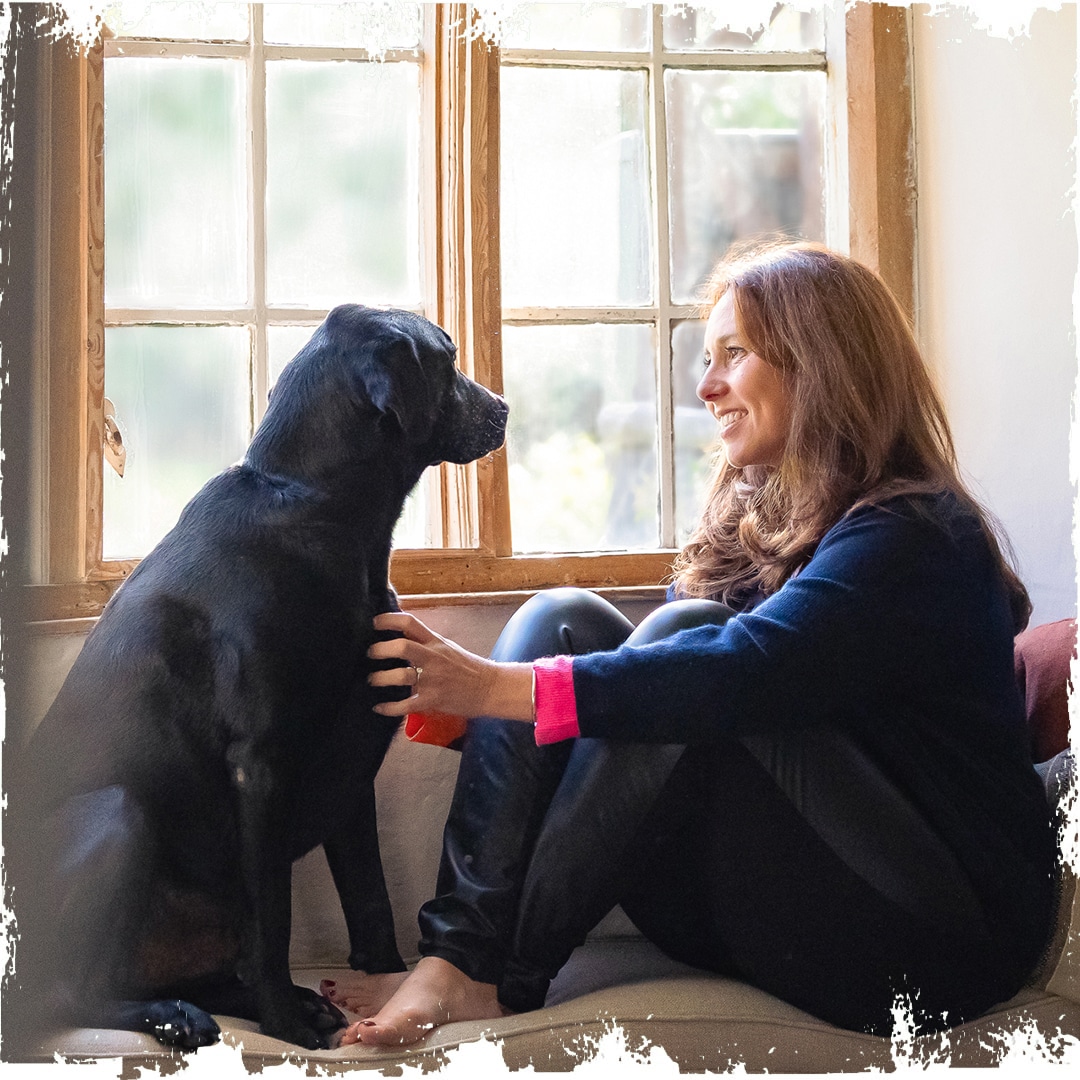 Photo of our founder Emma Heathcote-James with dog Henry.